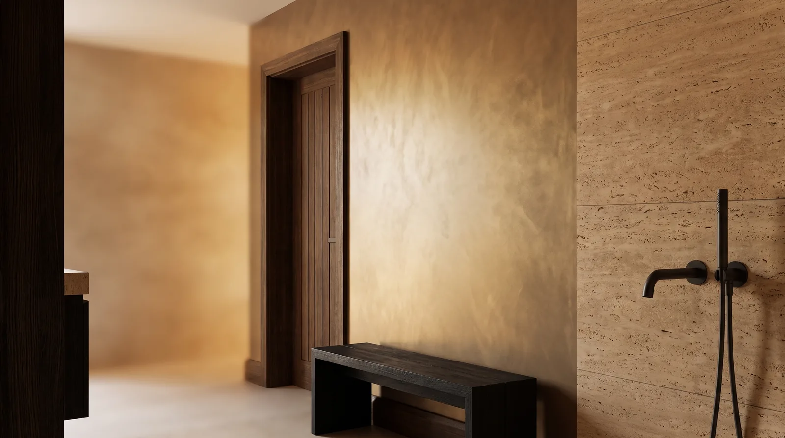 Warm light washing gently across a bronze-toned plaster wall.